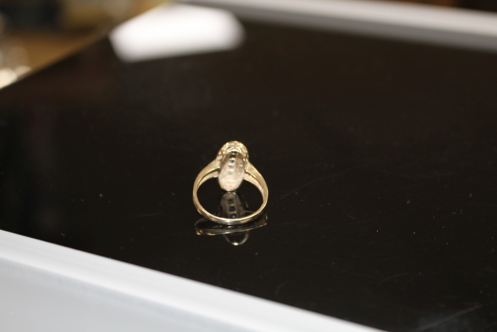 A modern Art Deco style 9ct gold, sapphire and diamond set oval dress ring, size Q/R, gross weight 3.3 grams.